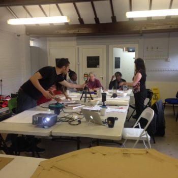 workshop participants working around a table in Furtherfield Commons
