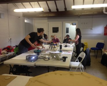 workshop participants working around a table in Furtherfield Commons