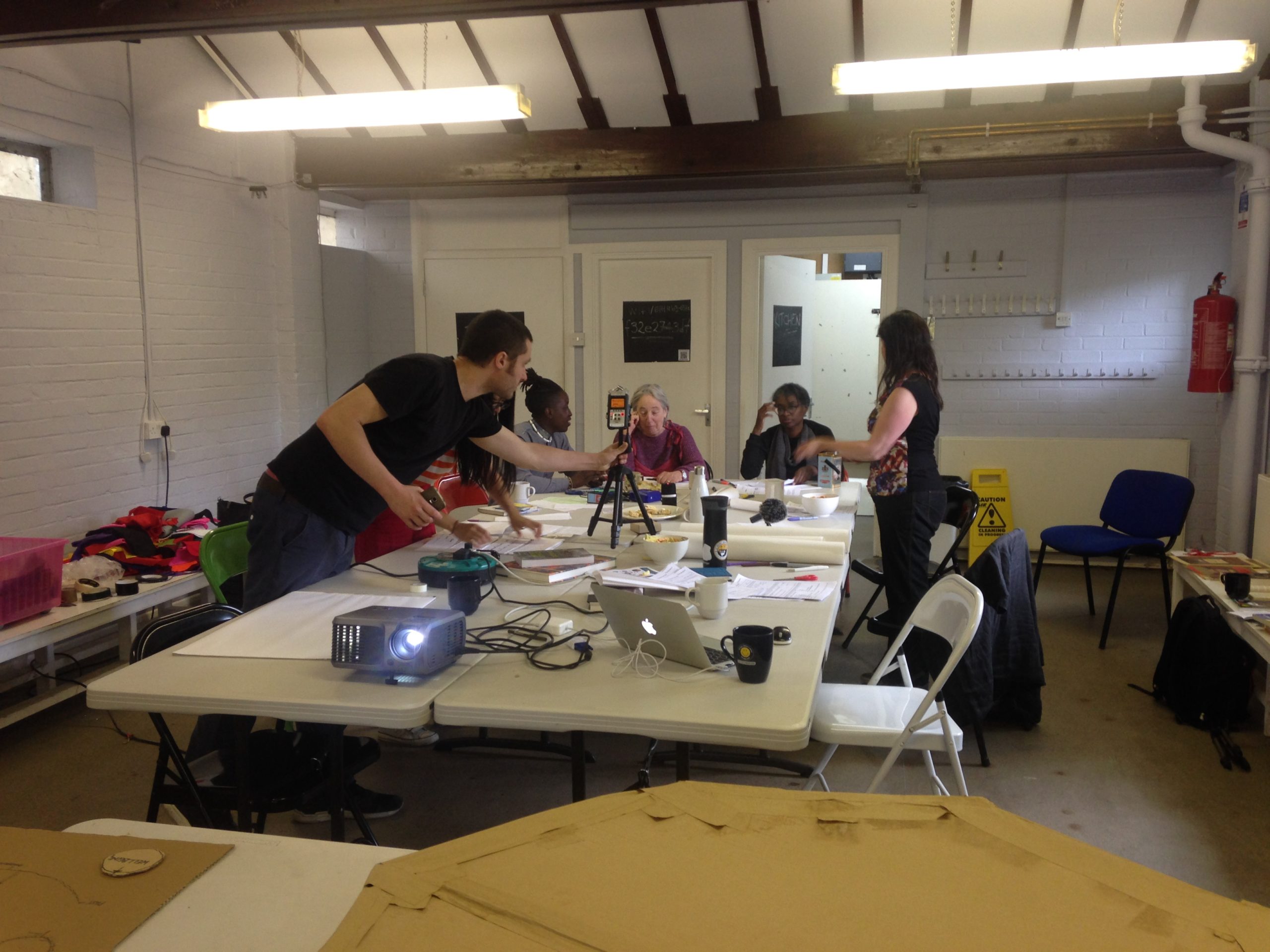 workshop participants working around a table in Furtherfield Commons