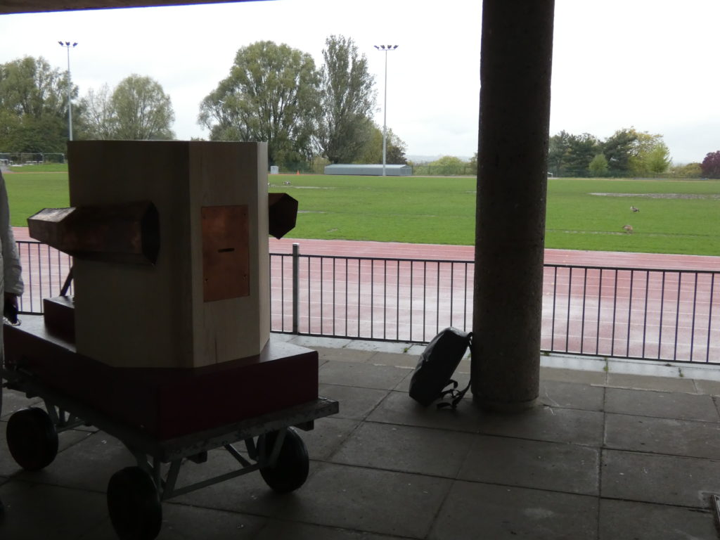 Future Machine in shadow with the athletics track behind in Finsbury Park