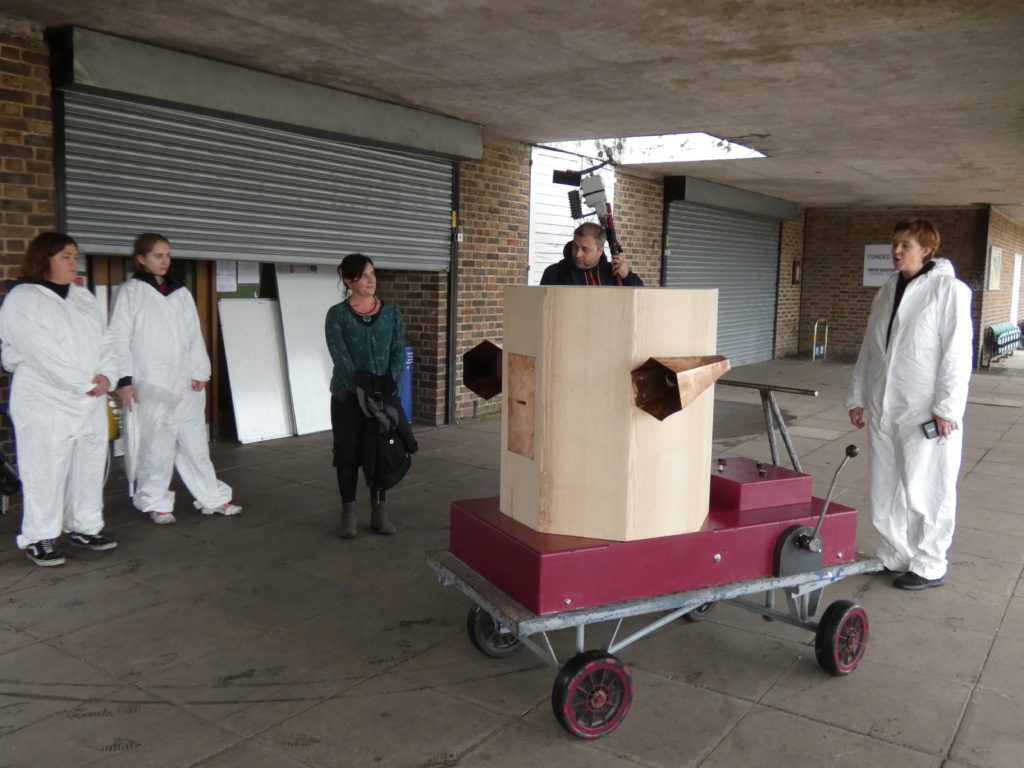 The Future Machine, Rachel Jacobs, Dominic Price holding the weather station pole, Ruth Catlow and volunteers in white suits