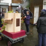 Future Machine decorated with hops and people who attended the launch in the rain