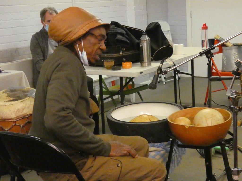 Alex with a mask and water drums