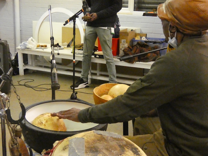 Alex playing a water drum