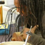 Alex playing a djembe