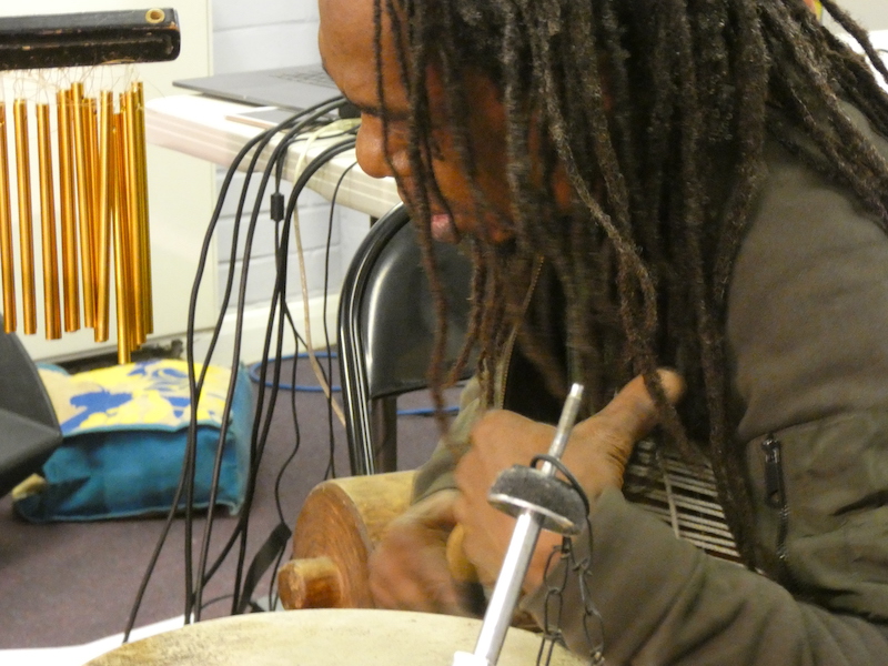 Alex playing a djembe