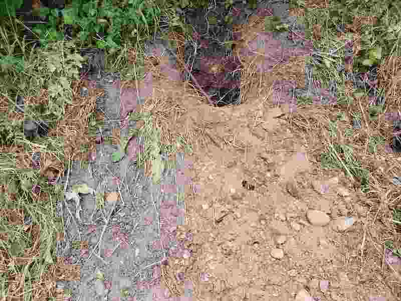 hole in pink, brown and grey earth