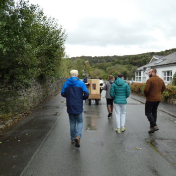 Future Machine leading a walk down to the River Leven, people, Future Machine, road, trees