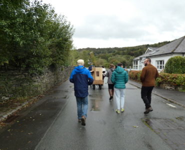 Future Machine leading a walk down to the River Leven, people, Future Machine, road, trees