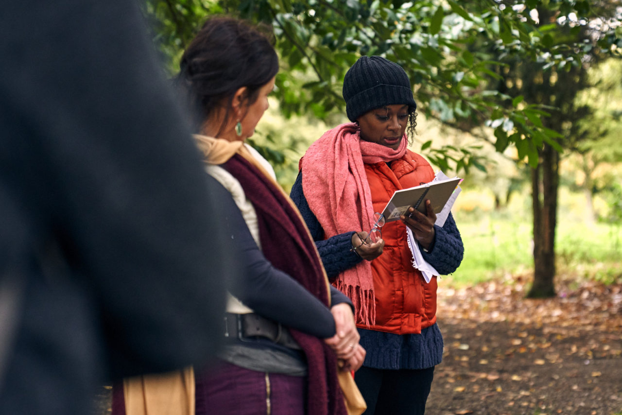 Esi Eshun reading out a quote with Rachel in front