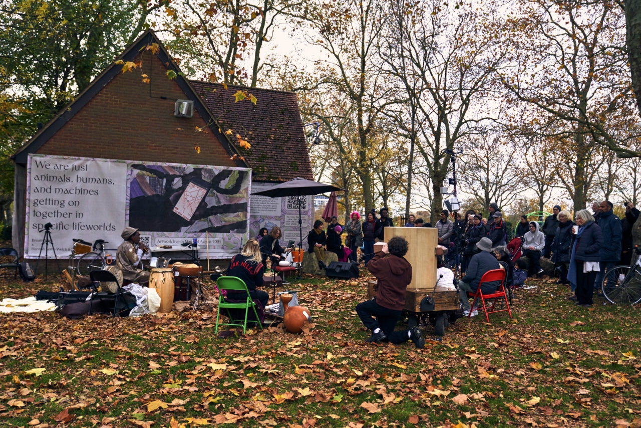 People watching, Future Machine, musicians, autumn leaves, plane tree, playground and trees in the background