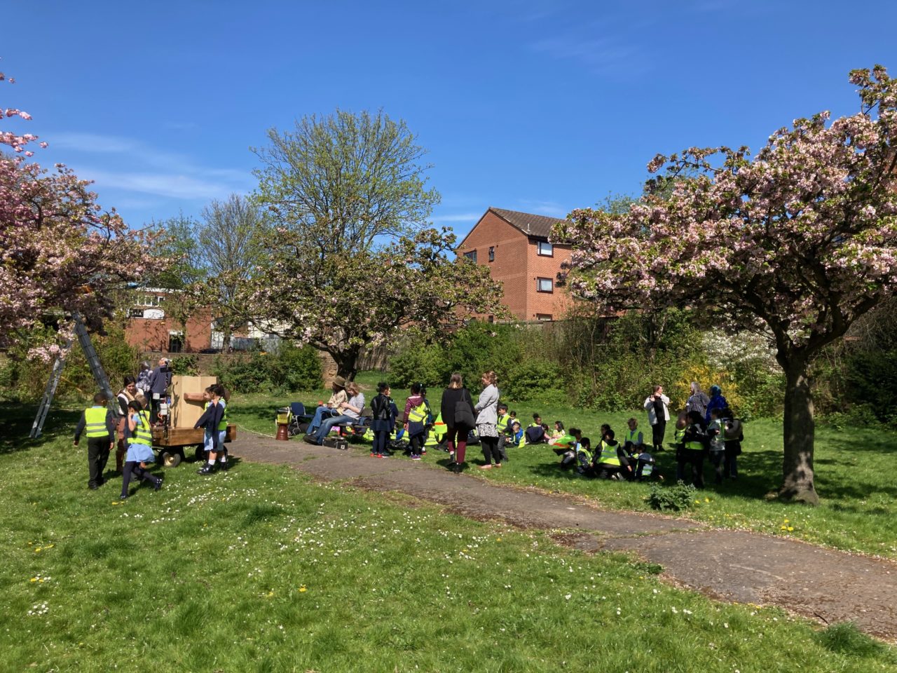 Pupils from Mellers Primary in Christr Church Gardens, meeting Future Machine and dancing to the music of the weather