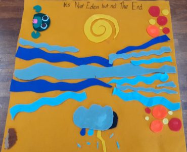 Felt Data Map titled It's Not Eden But Not The End with water, sun, storm clouds and a frog