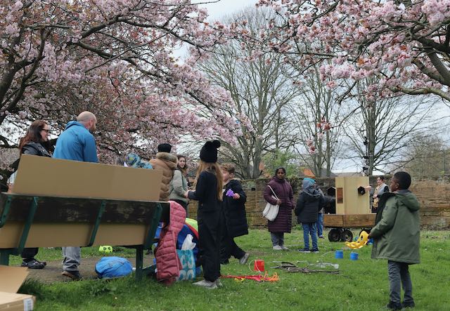 Families with Future Machine under the blossom trees