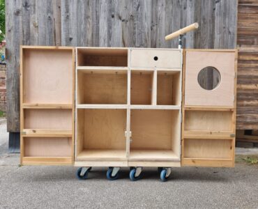 The final wooden cabinet with doors open before staining and fittings