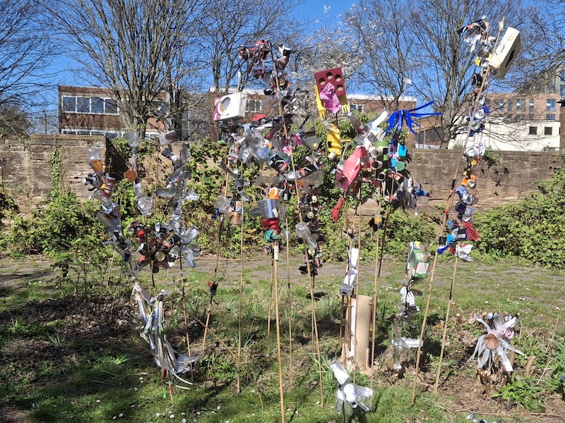 The rose garden with flowers made of litter