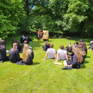 Future Machine, Rachel and the pupils in the field with trees behind
