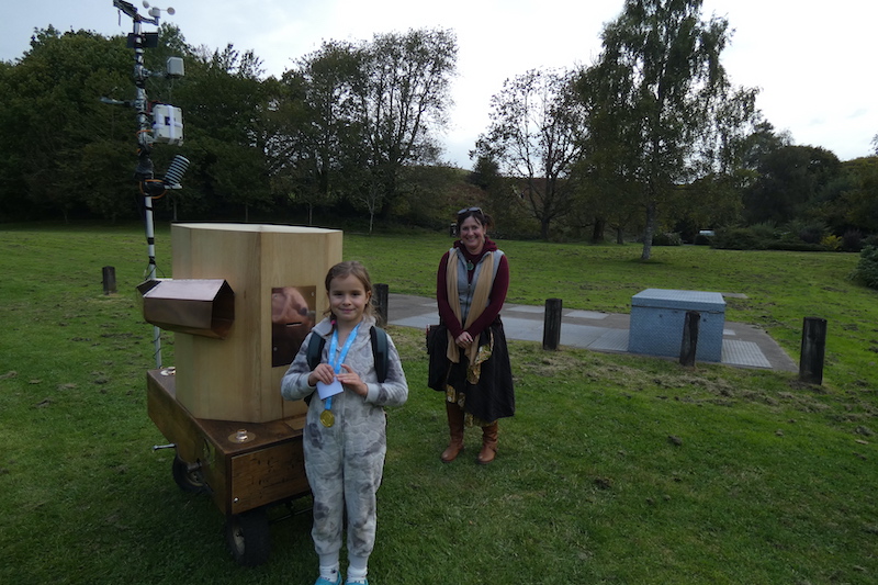 A girl with an award from doing activities on the lake came to speak to meet Future Machine and speak to the future