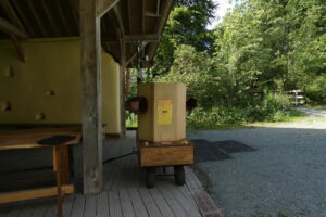 close up of Future Machine with The Footprint building and trees in the background