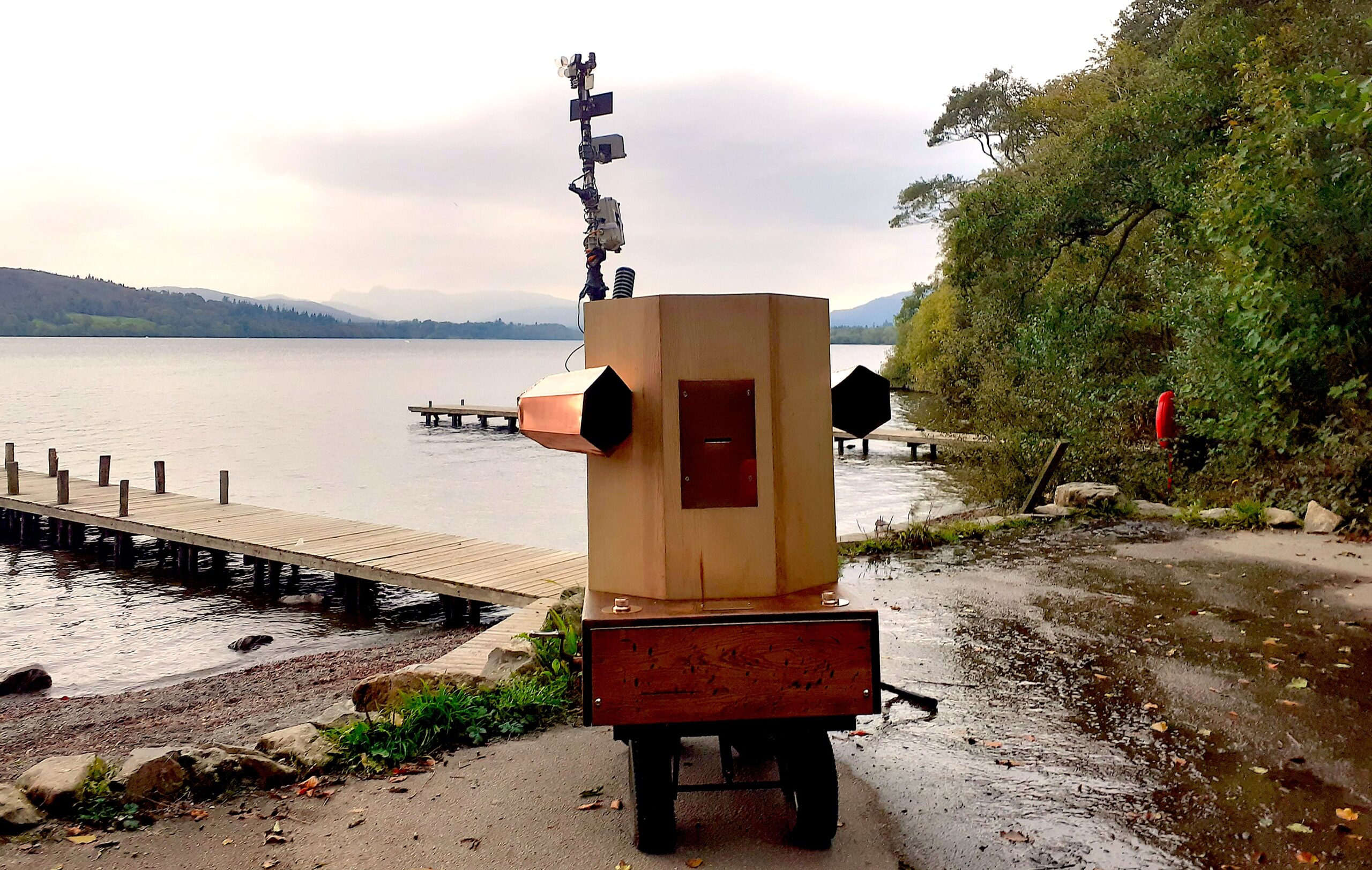 Future Machine by the shores of Lake Windermere at dusk
