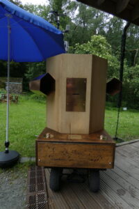 Future Machine in the rain with an umbrella