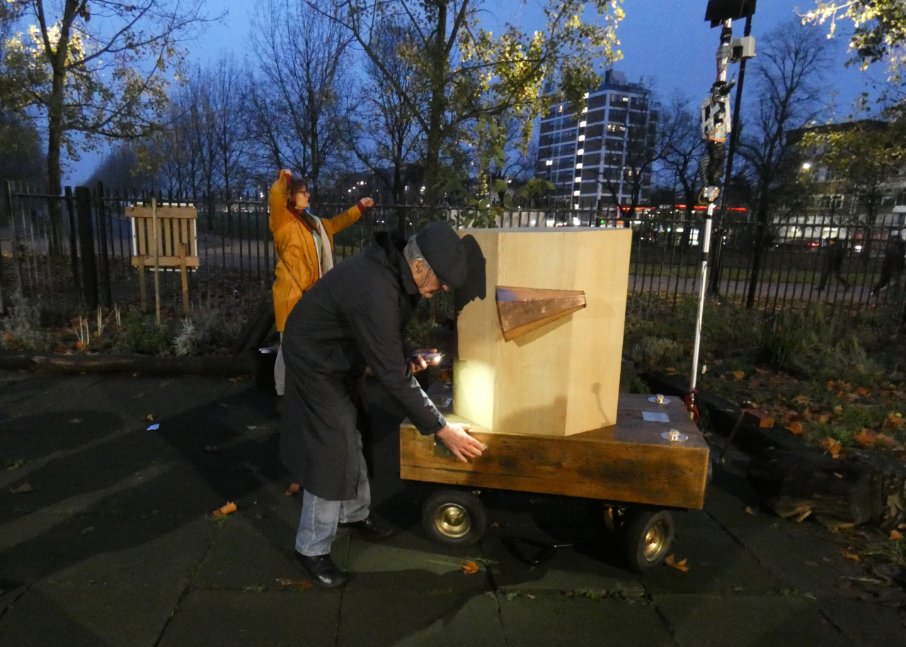 a man pressing Future Machine's button, with a woman dancing in the background