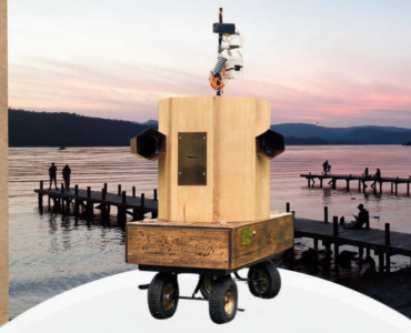 Future Machine with the jetties on Lake Windermere at sunset